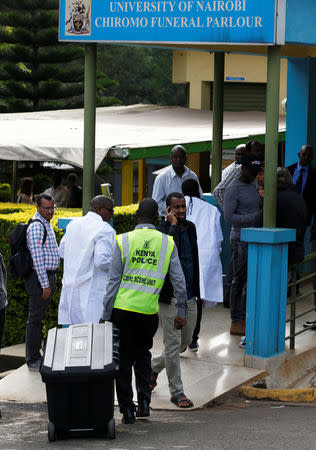 Kenyan police crimes scene experts arrive at the Chiromo mortuary to asses the dead bodies recovered from the scene where explosions and gunshots were heard at the Dusit hotel compound, in Nairobi, Kenya January 16, 2019. REUTERS/Thomas Mukoya