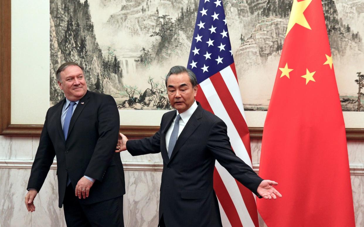 US Secretary of State Mike Pompeo and Chinese Foreign Minister Wang Yi meet Monday in Beijing - REUTERS