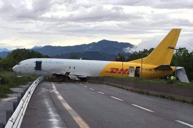 DHL plane overshoots runway, lands on busy road