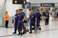 Policemen lead dogs to search West Kowloon terminus, the venue of the opening ceremony of the Hong Kong Section of the Guangzhou-Shenzhen-Hong Kong Express Rail Link, in Hong Kong, China September 22, 2018. REUTERS/Tyrone Siu