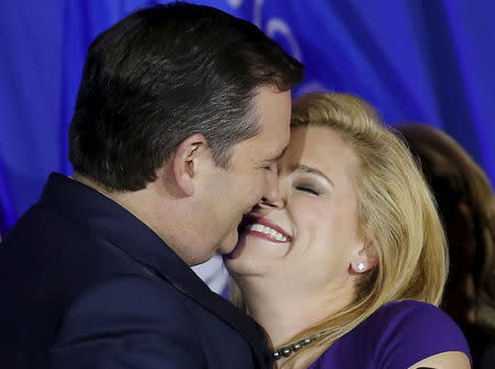 U.S. Republican presidential candidate Ted Cruz embraces his wife Heidi at his Wisconsin primary night rally in Milwaukee, Wisconsin, United States, April 5, 2016. REUTERS/Jim Young