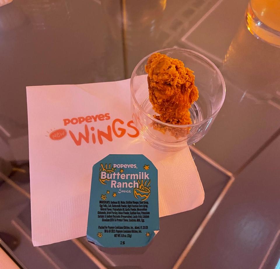 Close-up of the new wing flavor with a packet of buttermilk ranch dressing