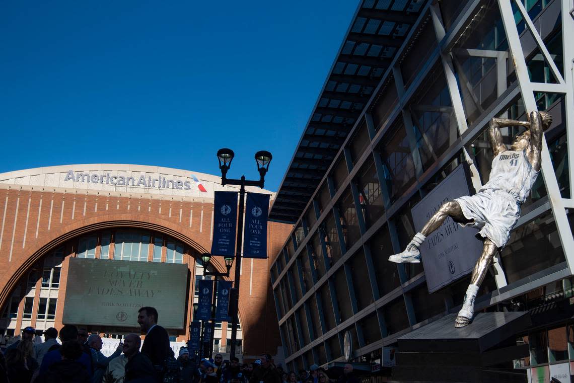 Dirk Nowitzki’s statue is unveiled during the “All Four One” statue ceremony in front of the American Airlines Center in Dallas, Sunday, Dec. 25, 2022. (AP Photo/Emil T. Lippe)