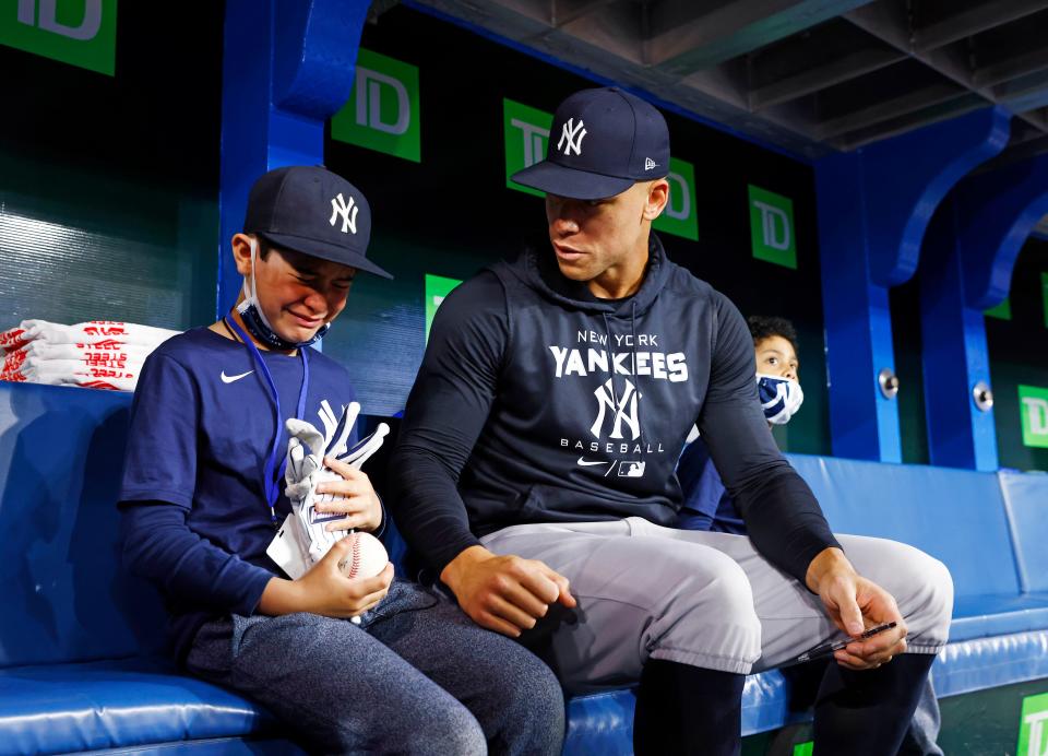 Derek Rodriguez, 9, reacts while meeting Yankees slugger Aaron Judge before Wednesday's game in Toronto against the Blue Jays.