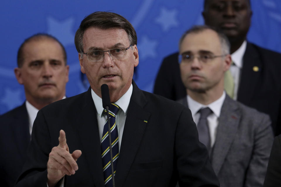 Brazil's President Jair Bolsonaro speaks during a press conference on the resignation of Justice Minister Sergio Moro, at the Planalto Presidential Palace in Brasilia, Brazil, Friday, April 24, 2020. Moro, who became popular as a crusader against corruption, resigned on Friday, alleging political interference in the federal police force. (AP Photo/Eraldo Peres)