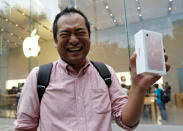 First buyer Sho Inoue shows Apple's new iPhone 7 after purchasing the device at the Apple Store at Tokyo's Omotesando shopping district, Japan, September 16, 2016. REUTERS/Issei Kato TPX IMAGES OF THE DAY