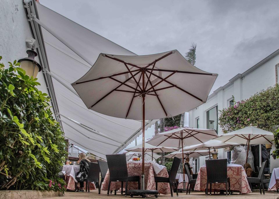 The outdoor dining area at Renato’s, seen here on Monday, has been less appealing to patrons this winter season, which has been marked by rain and cloudy skies.