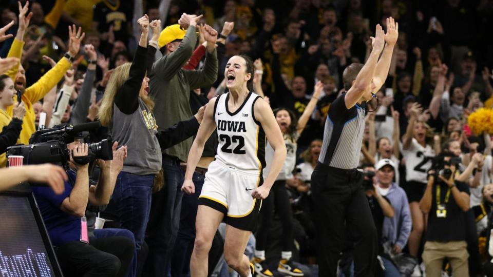 PHOTO: Caitlin Clark #22 of the Iowa Hawkeyes celebrates after breaking the NCAA women's all-time scoring record during the first half against the Michigan Wolverines at Carver-Hawkeye Arena on Feb. 15, 2024 in Iowa City, Iowa.  (Matthew Holst/Getty Images)