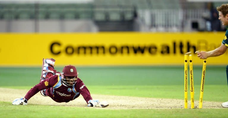Australian James Faulkner (right) runs out West Indies batsman Devon Thomas at the Melbourne Cricket Ground on February 10, 2013. Australia bowled out West Indies for 257 to secure a 17-run victory and a 5-0 whitewash in their one-day international series