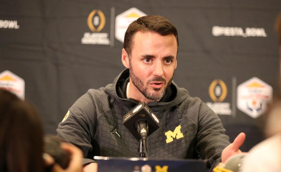 Michigan defensive coordinator Jesse Minter talks with reporters about the Fiesta Bowl against TCU on Wednesday, Dec. 28, 2022, in Scottsdale, Arizona.