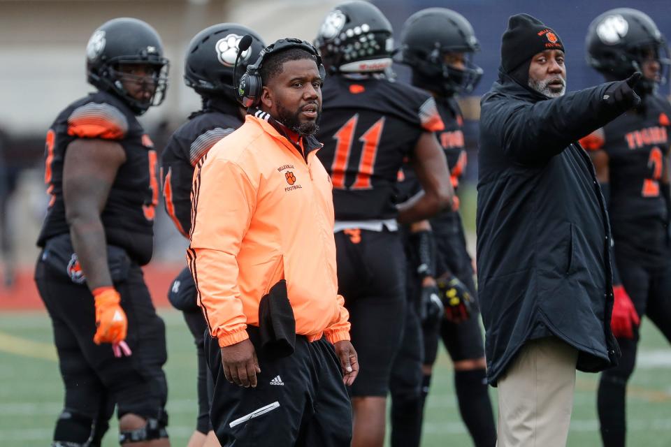Belleville head coach Jermain Crowell talks to players at a timeout during the first half against Dearborn Fordson at Belleville High School in Belleville on Saturday, Nov. 13, 2021.