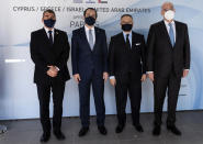 From left to right, Israel foreign minister Gabi Ashkenazi, Cypriot foreign minister Nicos Chrisodoulides, Anwar Gargash of United Arab Emirate and Greek foreign minister Nikos Dendias pose for photo before their meeting of the ministers of foreign affairs of Cyprus, Greece, Israel and United Arab of Emirates in city of Paphos, Cyprus, Friday, April 16, 2021. The event marks the first time the foreign ministers of all four countries have met following the recent normalization of relations between Israel and the United Arab Emirates and aims to expand cooperation to bolster regional stability. (Iakovos Hatzistavrou/Pool via AP)