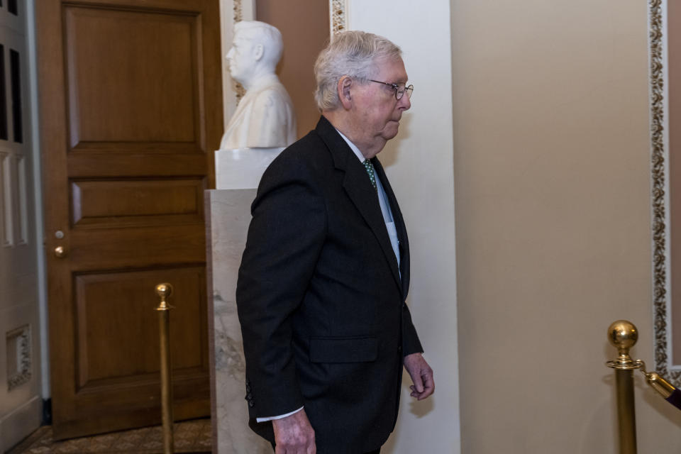 Senate Minority Leader Mitch McConnell, R-Ky., leaves a meeting with fellow Republicans as lawmakers rush to complete passage of a $1.7 trillion bill to fund the government before a midnight Friday deadline or face the prospect of a partial government shutdown going into the Christmas holiday, at the Capitol in Washington, Wednesday, Dec. 21, 2022. (AP Photo/J. Scott Applewhite)