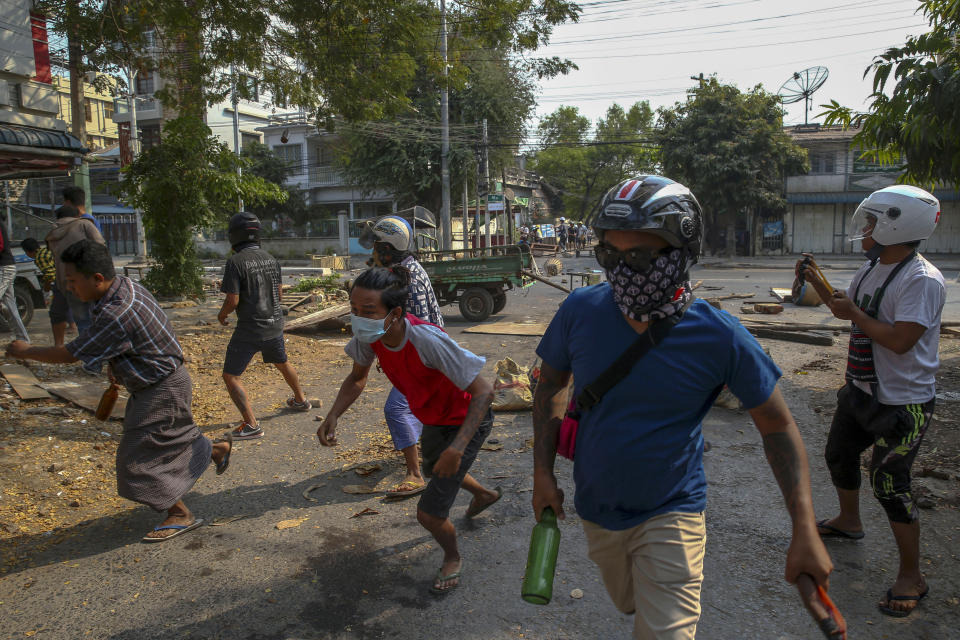 Anti-coup protestors run away from charging riot policemen in Mandalay, Myanmar, Tuesday, March 2, 2021. Demonstrators in Myanmar took to the streets again on Tuesday to protest last month’s seizure of power by the military, as foreign ministers from Southeast Asian countries met to discuss the political crisis. Police in Yangon, Myanmar’s biggest city, used tear gas and rubber bullets against the protesters. (AP Photo)