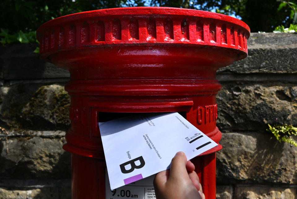 News outlets also need to be cautious when reporting details of postal ballots. (Photo by Paul ELLIS / AFP) (Photo by PAUL ELLIS/AFP via Getty Images)