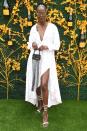 <p>Wearing a white shirt dress with gladiator sandals.</p>