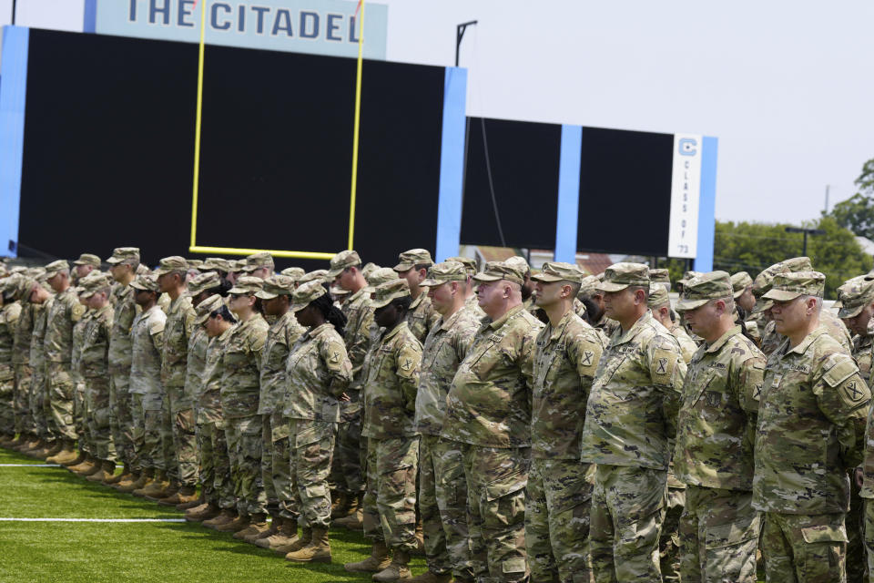 Maj. Michael Haley, at right, stands and looks at the crowd during a deployment ceremony for his South Carolina National Guard unit on Saturday, June 17, 2023, in Charleston, S.C. Haley's yearlong deployment to Africa will encompass much of the campaign of his wife, former Gov. Nikki Haley, for the 2024 GOP presidential nomination. (AP Photo/Meg Kinnard)