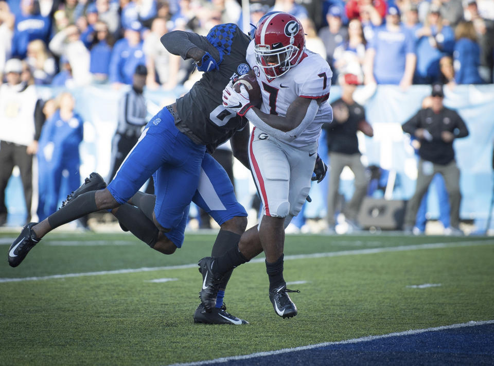 Georgia running back D'Andre Swift (7) rushes for a touchdown during the first half an NCAA college football game against Kentucky in Lexington, Ky., Saturday, Nov. 3, 2018. (AP Photo/Bryan Woolston)