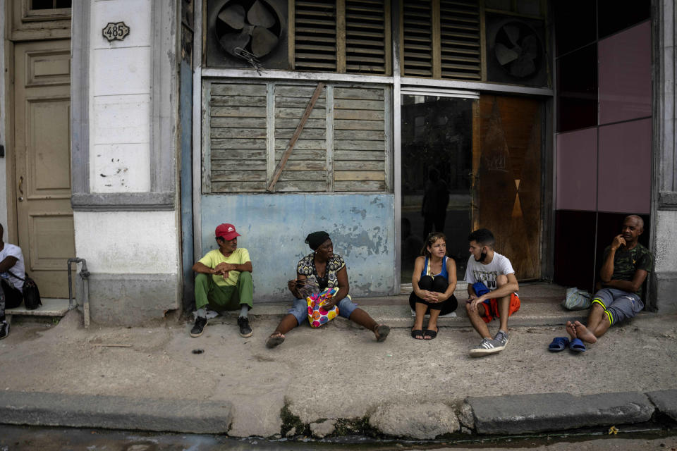 Residents wait their turn to shop at a government store in Havana, Cuba, Saturday, July 9, 2022. A year after the largest protests in decades shook Cuba's single-party government, the economic and political factors that caused them largely remain. (AP Photo/Ramon Espinosa)