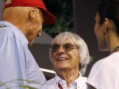Formula One Chief Executive Bernie Ecclestone (C) talks with former Formula One racing driver and three-time F1 World Champion Niki Lauda of Austria after the qualifying session of the Singapore F1 Grand Prix at the Marina Bay street circuit in Singapore September 21, 2013. REUTERS/Natashia Lee (SINGAPORE - Tags: SPORT MOTORSPORT F1)