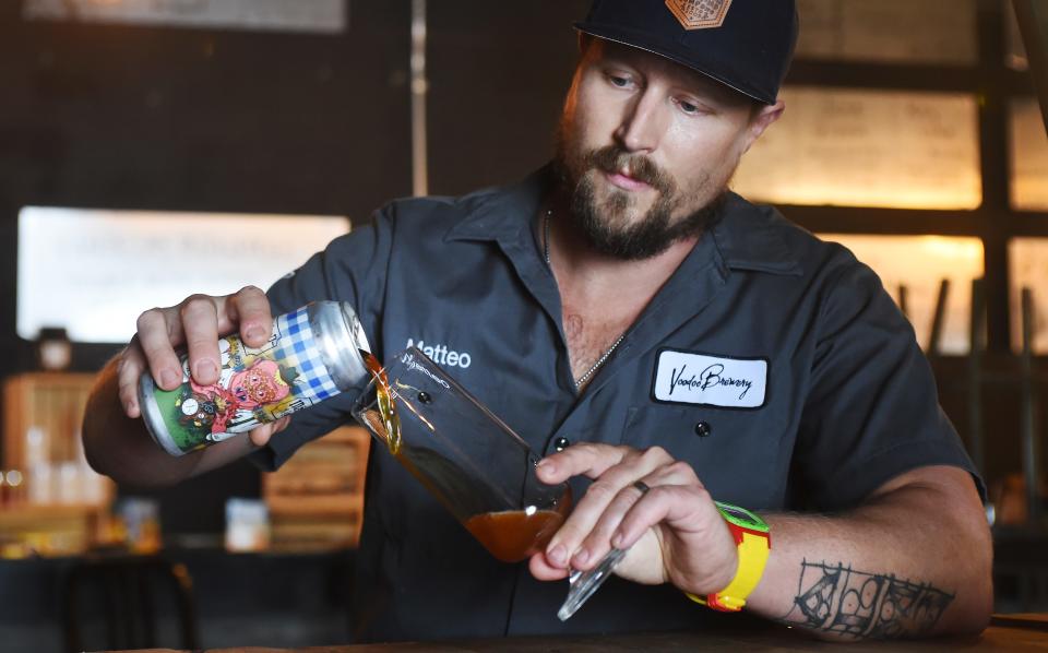 Matteo Rachocki, CEO of Voodoo Brewing Co., pours a Schnitzen-Giggle at the company's brewing facility in Meadville on Oct. 3.