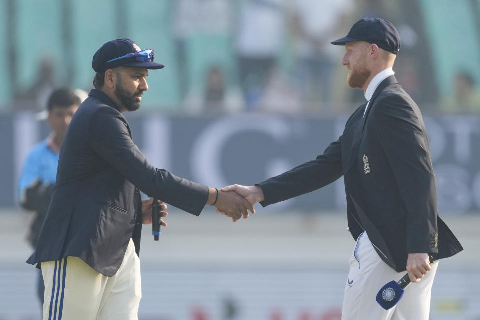 India's captain Rohit Sharma, left and England's captain Ben Stokes shakes hands after toss on the first day of the third cricket test match between India and England in Rajkot, India, Thursday, Feb. 15, 2024. India chose to bat first. (AP Photo/Ajit Solanki)