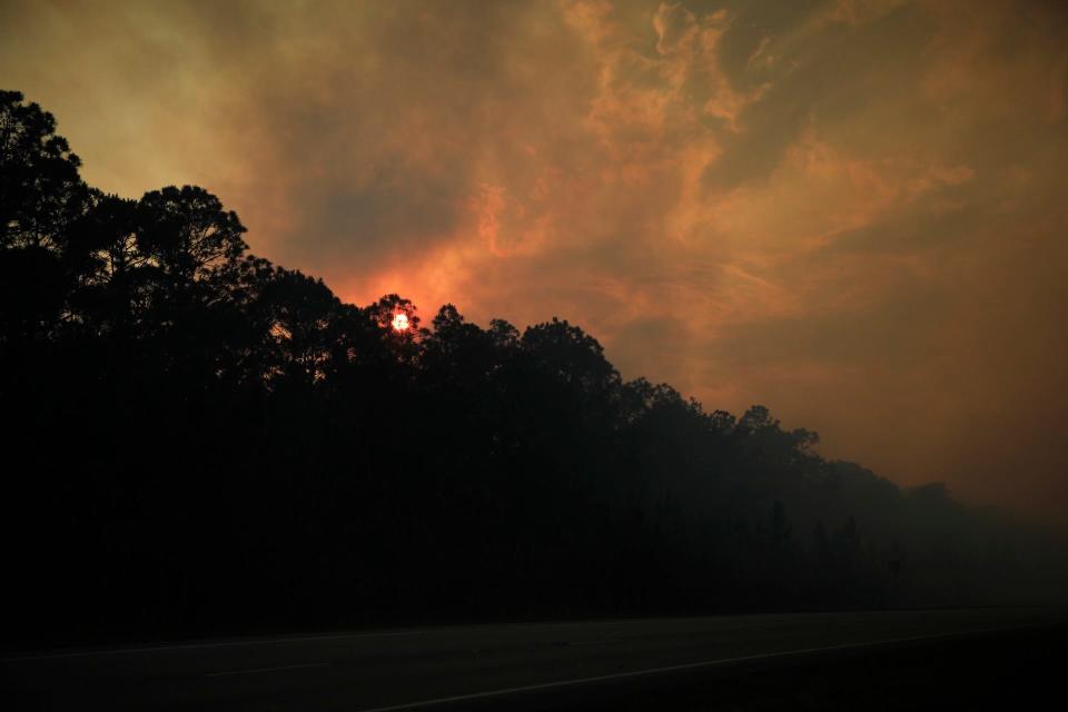 Smoke rises into the sky in Daytona Beach on Thursday night.