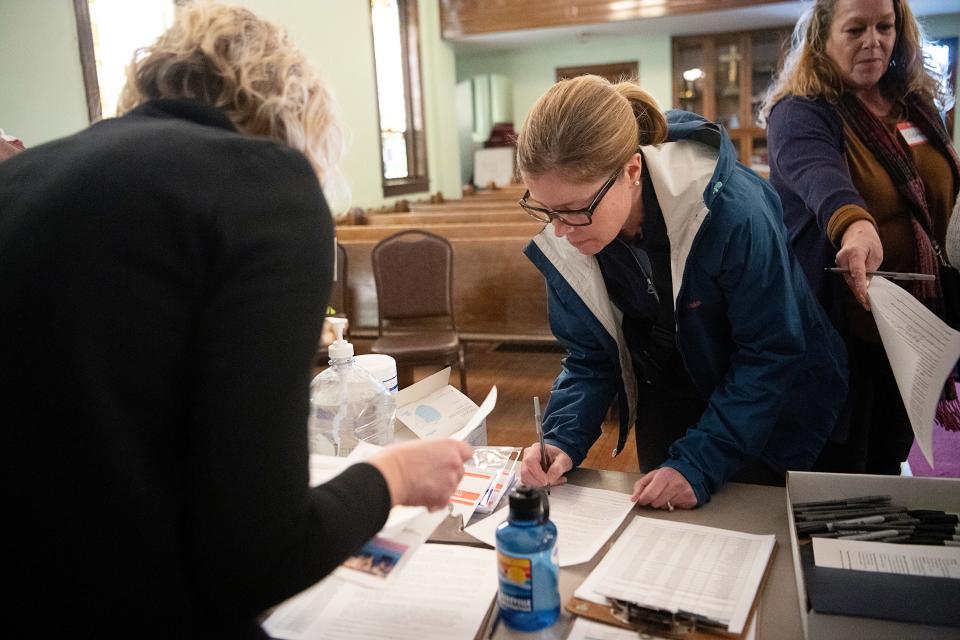 Asheville Mayor Esther Manheimer signs in as a volunteer for the annual point in time count at Haywood Congregation January 31, 2023.