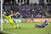 Orlando City forward Silvester van der Water, right, heads a ball past Atlanta United goalkeeper Alec Kann (25) for a goal during the second half of an MLS soccer match Friday, July 30, 2021, in Orlando, Fla. (Phelan M. Ebenhack/Orlando Sentinel via AP)