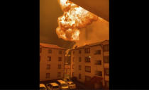This grab taken from video provided by Philip Awinyo Jeremiah shows a fireball after a vehicle loaded with gas which exploded, in Nairobi, Kenya, Friday, Feb. 2, 2024. The truck explosion ignited a huge fireball, and a flying gas cylinder set off a fire that burned down the Oriental Godown, a warehouse that deals with garments and textiles, according to government spokesman Isaac Mwaura. ( (Philip Awinyo Jeremiah via AP)