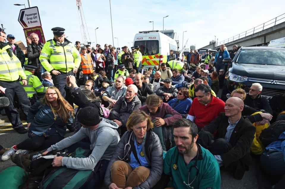 Protesters blocking the road outside City Airport during an Extinction Rebellion climate change protest (Kirsty O’Connor/PA) (PA Archive)