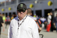 FILE - In this Feb. 8, 2020, file photo, NASCAR team owner Chip Ganassi walks near the garages during auto race practice at Daytona International Speedway in Daytona Beach, Fla. Kyle Larson was fired Tuesday, April 14, 2020, by Chip Ganassi Racing, completing a stunning downfall for the budding NASCAR star who uttered a racial slur during a live-streamed virtual race and then watched nearly every one of his sponsors drop him. (AP Photo/Terry Renna, File)