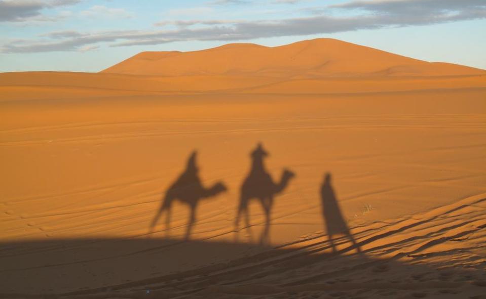 A slow camel mooch across the sandhills to our camp site included a brilliant sunset / Pictures: Ray Wilson