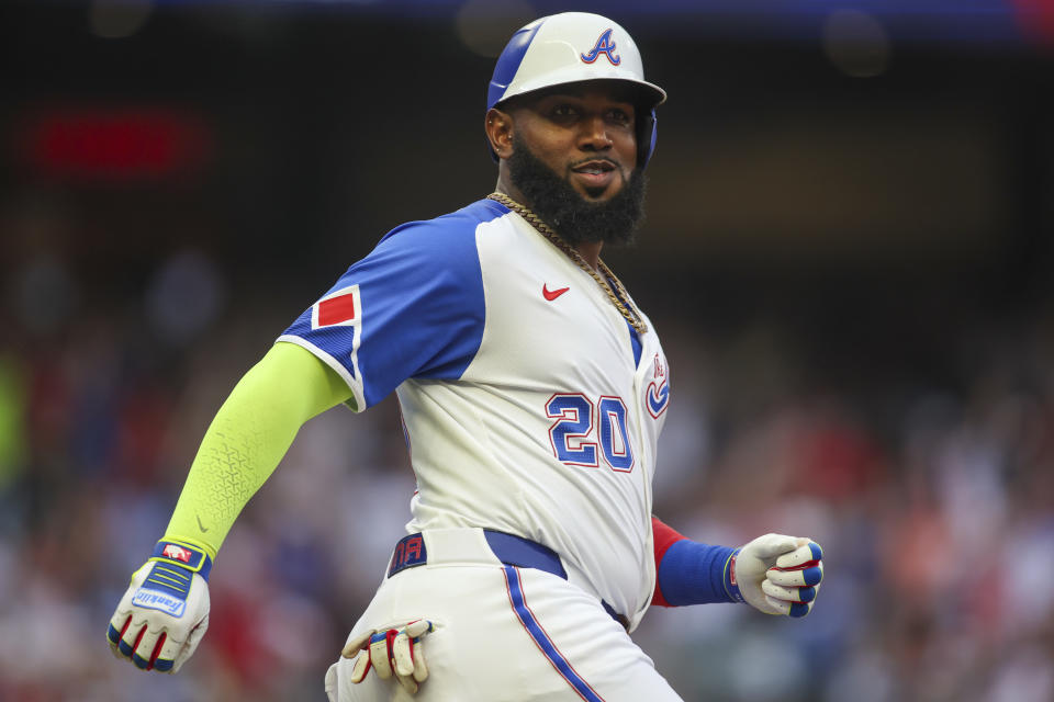 Atlanta Braves designated hitter Marcell Ozuna reacts after a two-run home run in the first inning of a baseball game against the Philadelphia Phillies, Saturday, July 6, 2024, in Atlanta. (AP Photo/Brett Davis)