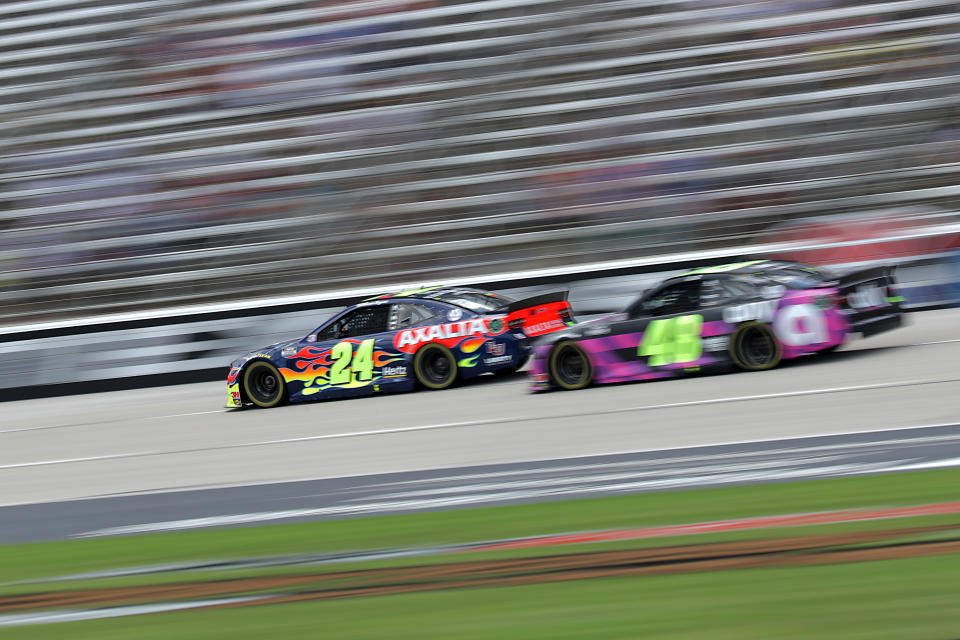FORT WORTH, TEXAS - JULY 19: William Byron, driver of the #24 Axalta Chevrolet, leads Jimmie Johnson, driver of the #48 Ally Chevrolet, during the NASCAR Cup Series O'Reilly Auto Parts 500 at Texas Motor Speedway on July 19, 2020 in Fort Worth, Texas. (Photo by Chris Graythen/Getty Images)