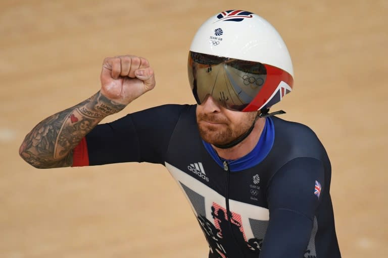 Bradley Wiggins celebrates after setting a world record with his British teammates in the men's team pursuit qualifying event at the Rio Olympics in August 2016