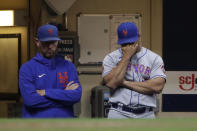 New York Mets manager Luis Rojas, right, is seen in the dugout during the fourth inning of a baseball game against the Milwaukee Brewers on Saturday, Sept. 25, 2021, in Milwaukee. Rojas was let go as manager of the New York Mets on Monday, Oct. 4, 2021, after two losing seasons. The team declined its option on Rojas’ contract for 2022, making the announcement a day after finishing third in the NL East at 77-85 in Steve Cohen’s first year of ownership. (AP Photo/Aaron Gash)