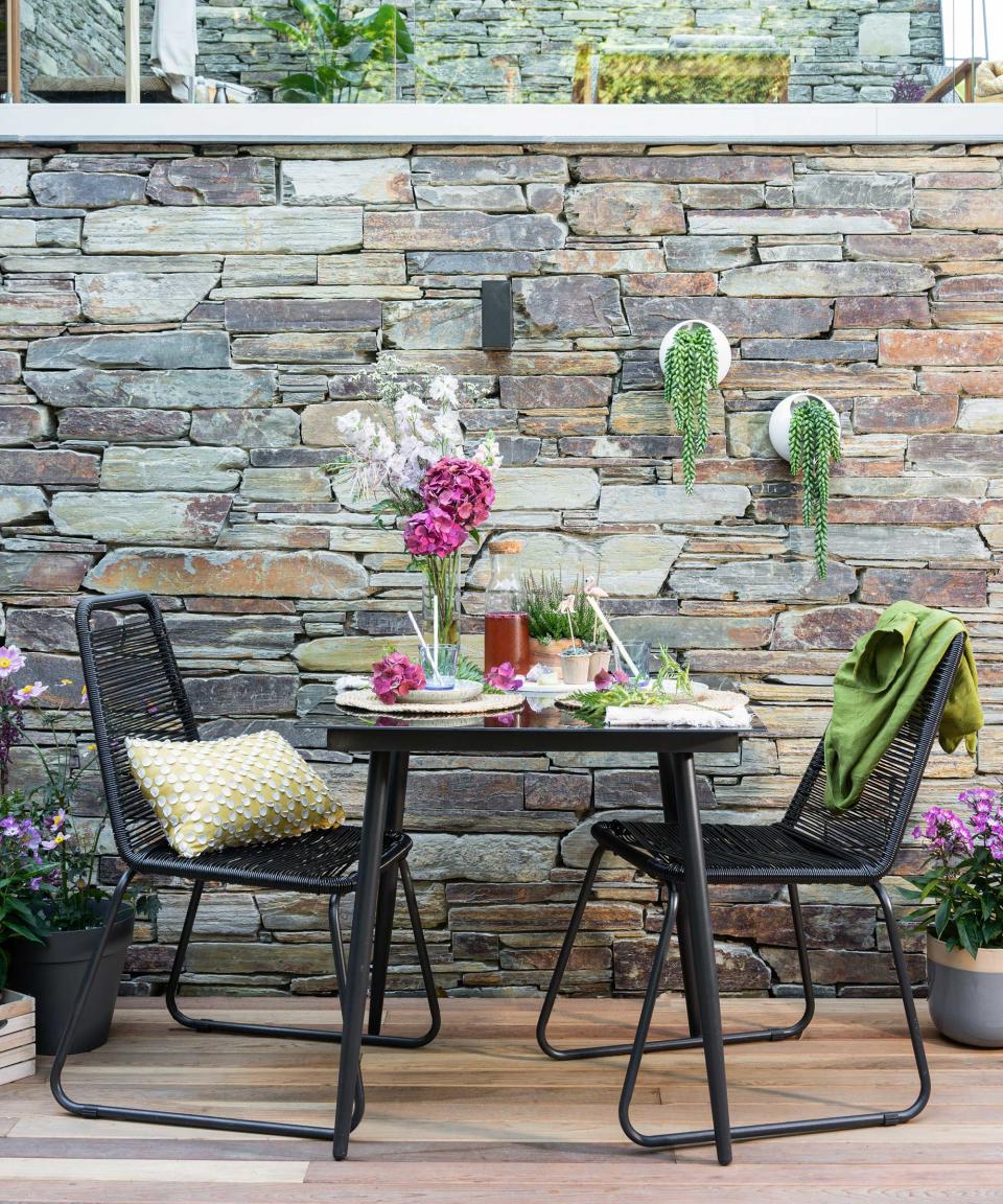 Mix up the textures with a stone wall beside your deck