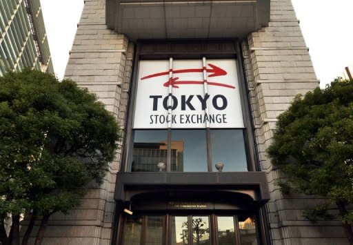 The Tokyo Stock Exchange building in Tokyo. Asian markets fell on Tuesday, as weakening demand for imports in China provided new evidence of a slowdown in the region's biggest economy and investors shrugged off a eurozone bid to help Spain