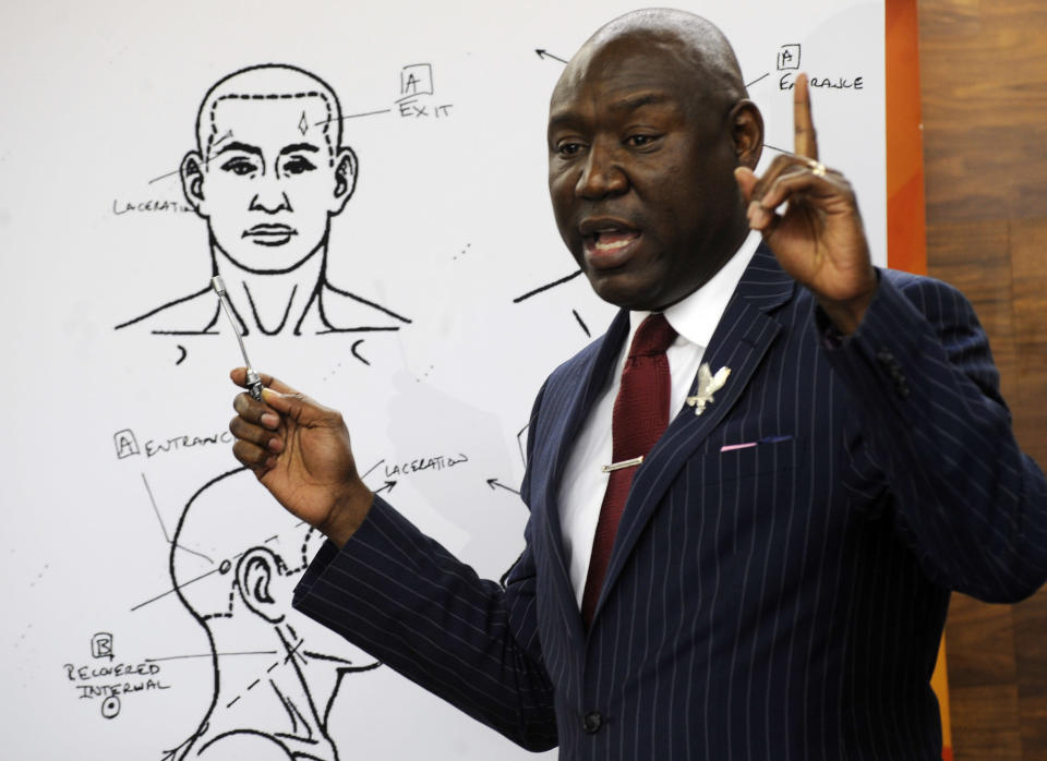 Attorney Ben Crump discusses the results of a forensic examination on Emantic "EJ" Bradford Jr., who was fatally shot by police in a shopping mall on Thanksgiving day, during a news conference in Birmingham, Ala., on Monday, Dec. 3, 2018. Crump, who represents Bradford's family, says a report shows the 21-year-old black man suffered three gunshot wounds to the back side of his body. (AP Photo/Jay Reeves)