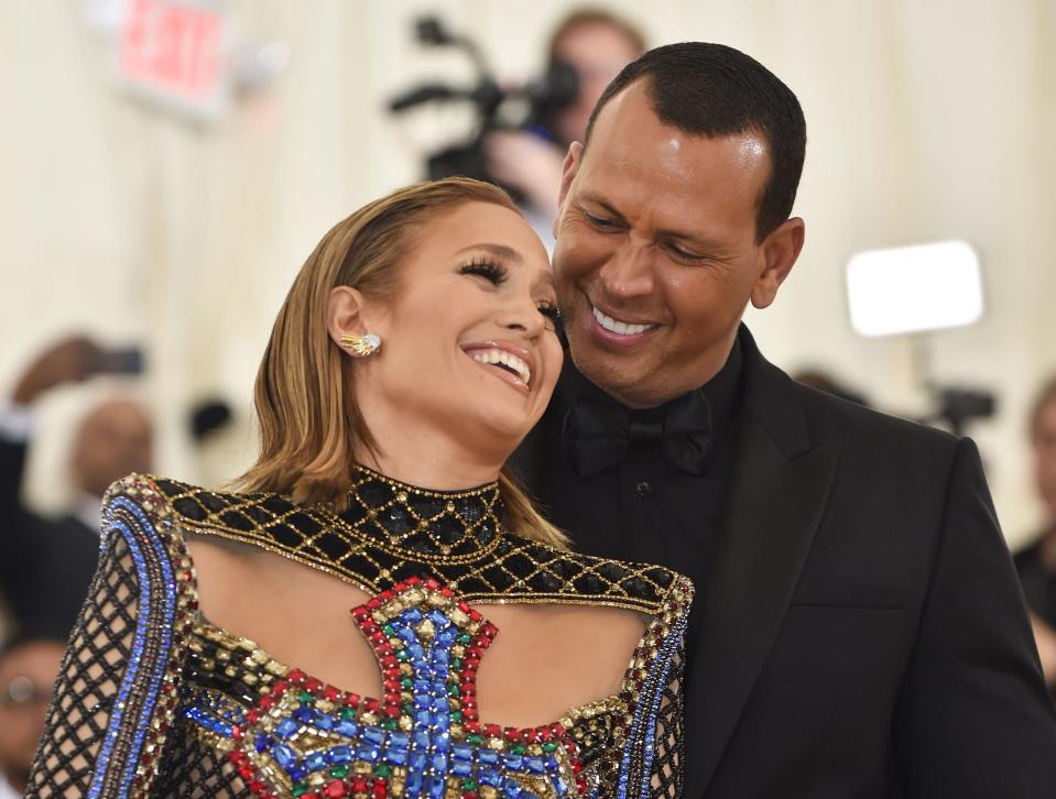 Jennifer Lopez and Alex Rodriguez arrive for the 2018 Met Gala. (Photo by Hector RETAMAL / AFP)