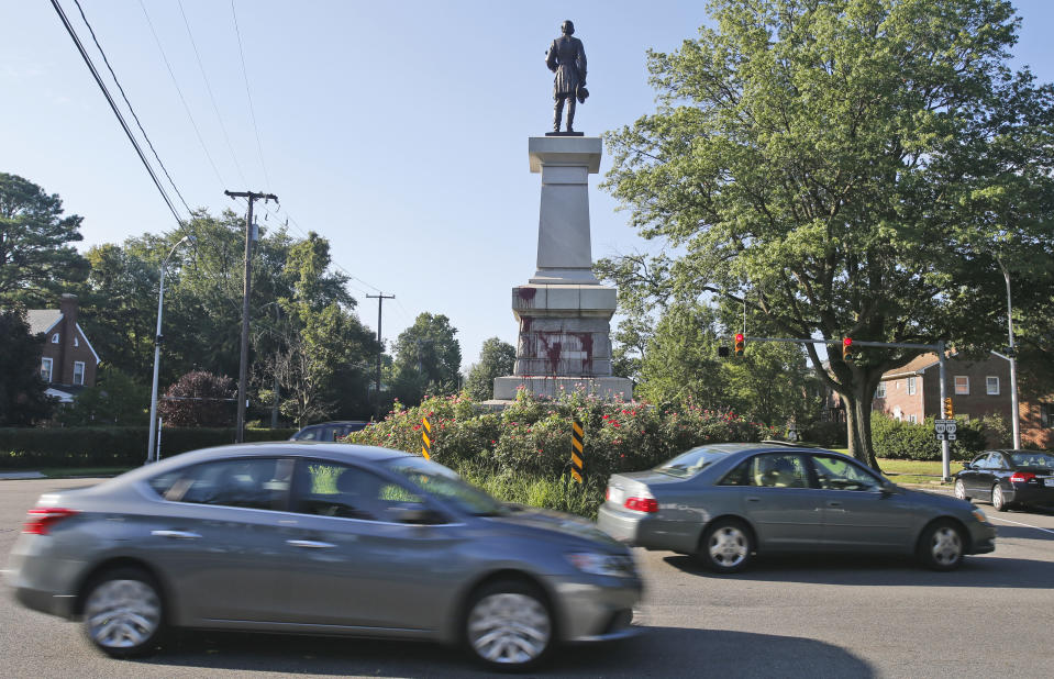 Cars pass by a statue of Confederate General A. P. Hill that was vandalized overnight in Richmond, Va., Wednesday, Aug. 22, 2018. Richmond has been debating what to do with its most prominent Confederate monuments along Monument Avenue in a different part of the city. The Hill statue hasn't been part of that discussion. (AP Photo/Steve Helber)