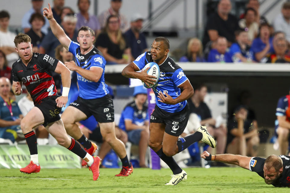 Kurtley Beale of Western Force breaks away from the tackle of Owen Franks, right, of the Crusaders during the Super Rugby Pacific rugby game in Perth, Australia, Saturday, April 20, 2024. (Gary Day/Western Force/AAP Image/ via AP)