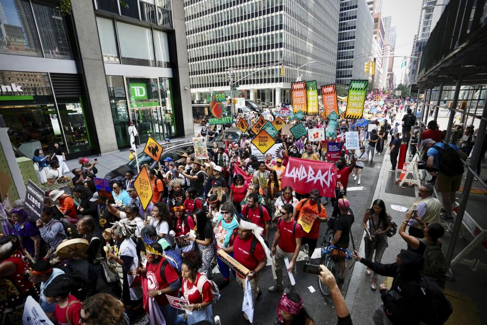 Climate activists march protesting energy policies and the use of fossil fuels, in New York, Sunday, Sept. 17, 2023. (AP Photo/Bryan Woolston)