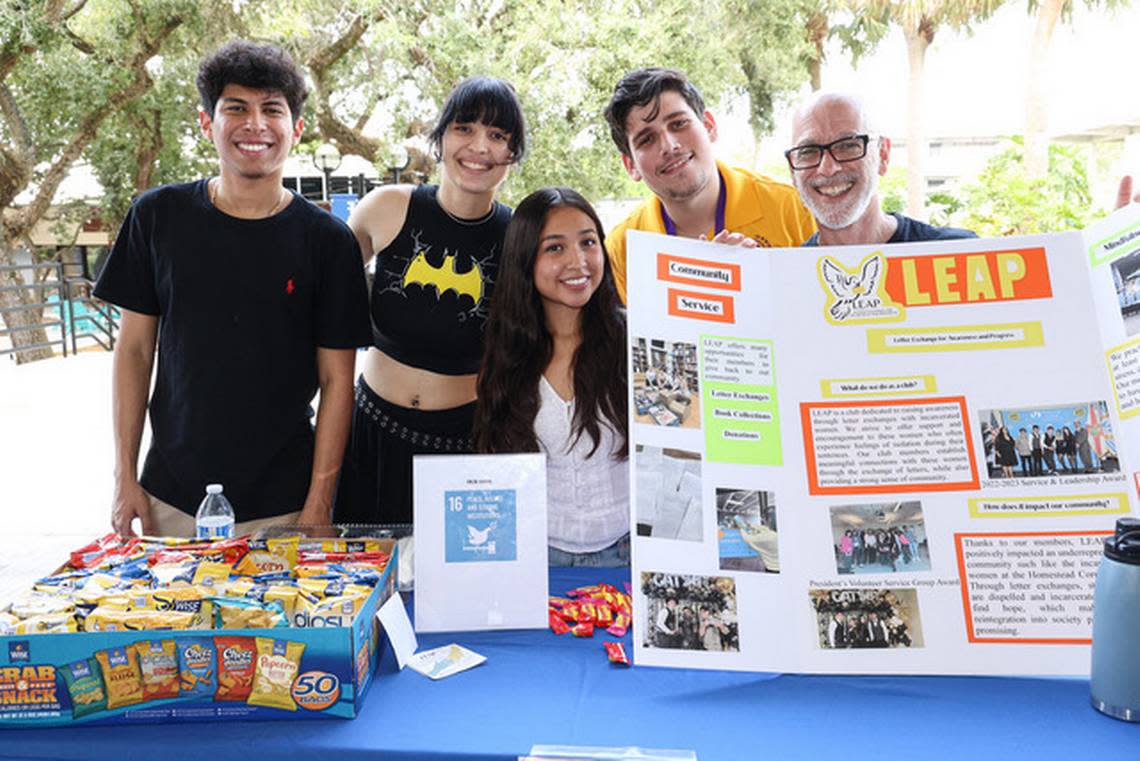 Students in the LEAP letter exchange club at Miami Dade College work with writing professor Carlos González and Exchange for Change..