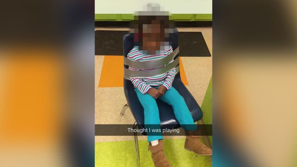 The little girl's parents were horrified after being shown a photo of her duct taped to a chair. Source: Facebook