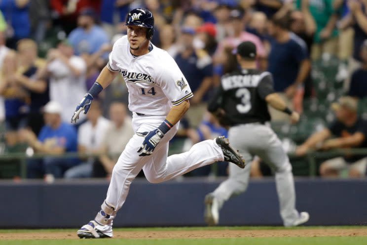 MILWAUKEE, WI - AUGUST 23: Hernan Perez #14 of the Milwaukee Brewers hits a two RBI triple during the seventh inning against the Colorado Rockies at Miller Park on August 23, 2016 in Milwaukee, Wisconsin. (Photo by Mike McGinnis/Getty Images)