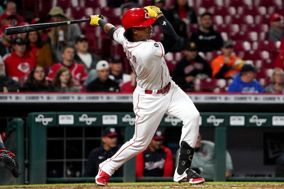 Cincinnati Reds center fielder Jose Barrero (38) hits a single in the fourth inning of a baseball game against the Washington Nationals, Thursday, Sept. 23, 2021, at Great American Ball Park in Cincinnati. 