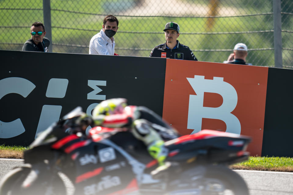 SPIELBERG, AUSTRIA - AUGUST 13: Maverick Viñales of Spain and Monster Energy Yamaha MotoGP looks on Aleix Espargaro of Spain and Aprilia Racing Team Gresini at turn three, after Yamaha suspends him to ride during the MotoGP Bitci Motorrad Grand Prix Free Practice at Red Bull Ring on August 13, 2021 in Spielberg, Austria. (Photo by Steve Wobser/Getty Images)