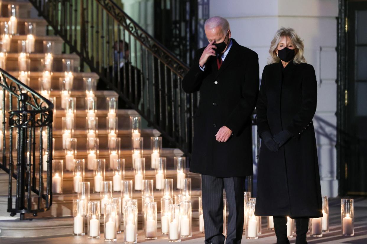 President Joe Biden commemorates the grim milestone of 500,000 U.S. deaths from the coronavirus disease (COVID-19) during a moment of silence and candle lighting ceremony at the White House in Washington (REUTERS)